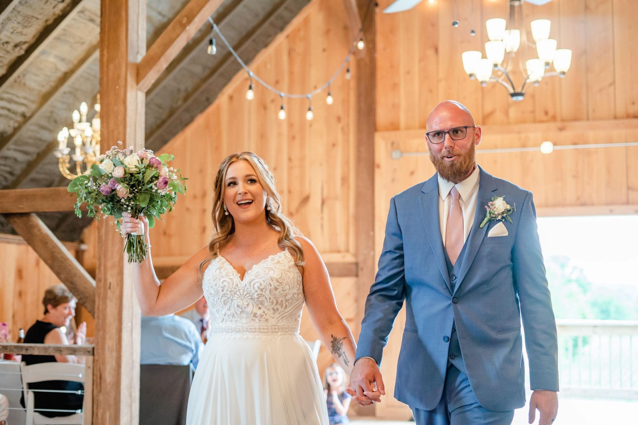 bride and groom entering reception