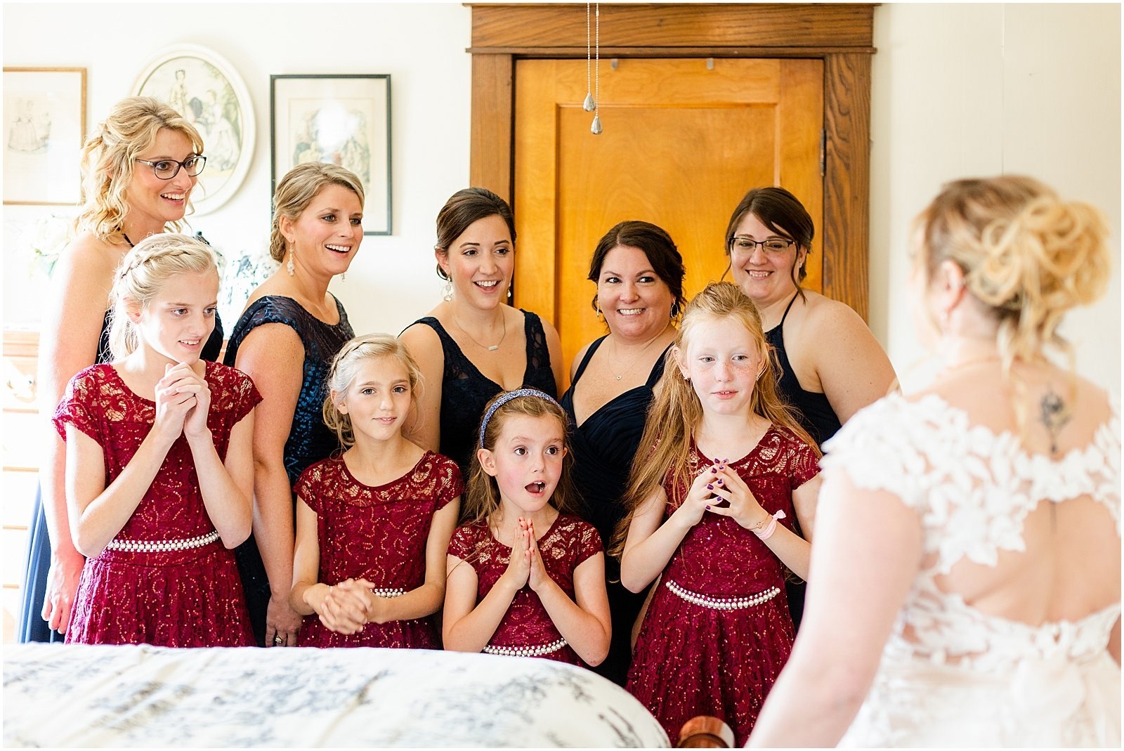 bridesmaids smiling at bride reveal