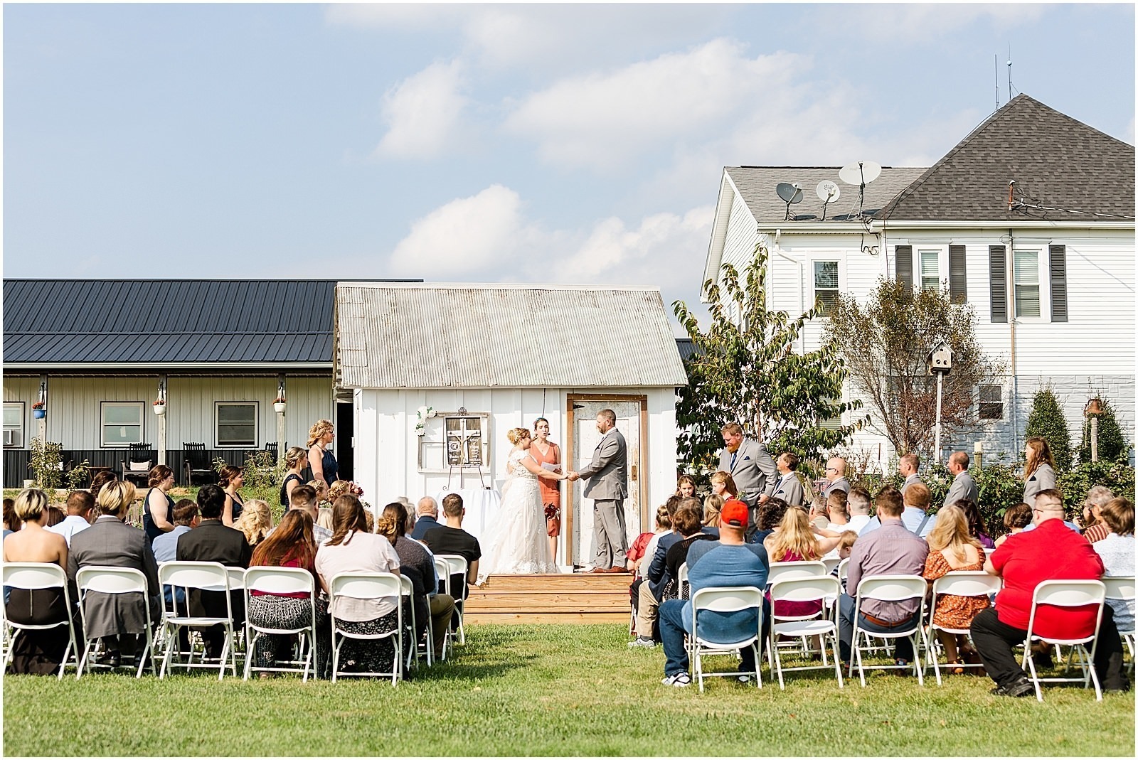 outdoor wedding ceremony outside vintage farm house