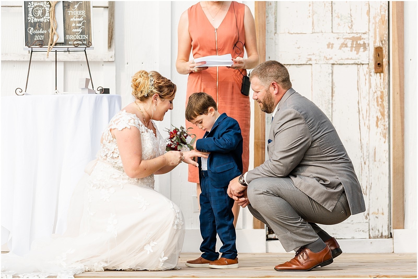 bride and groom with son