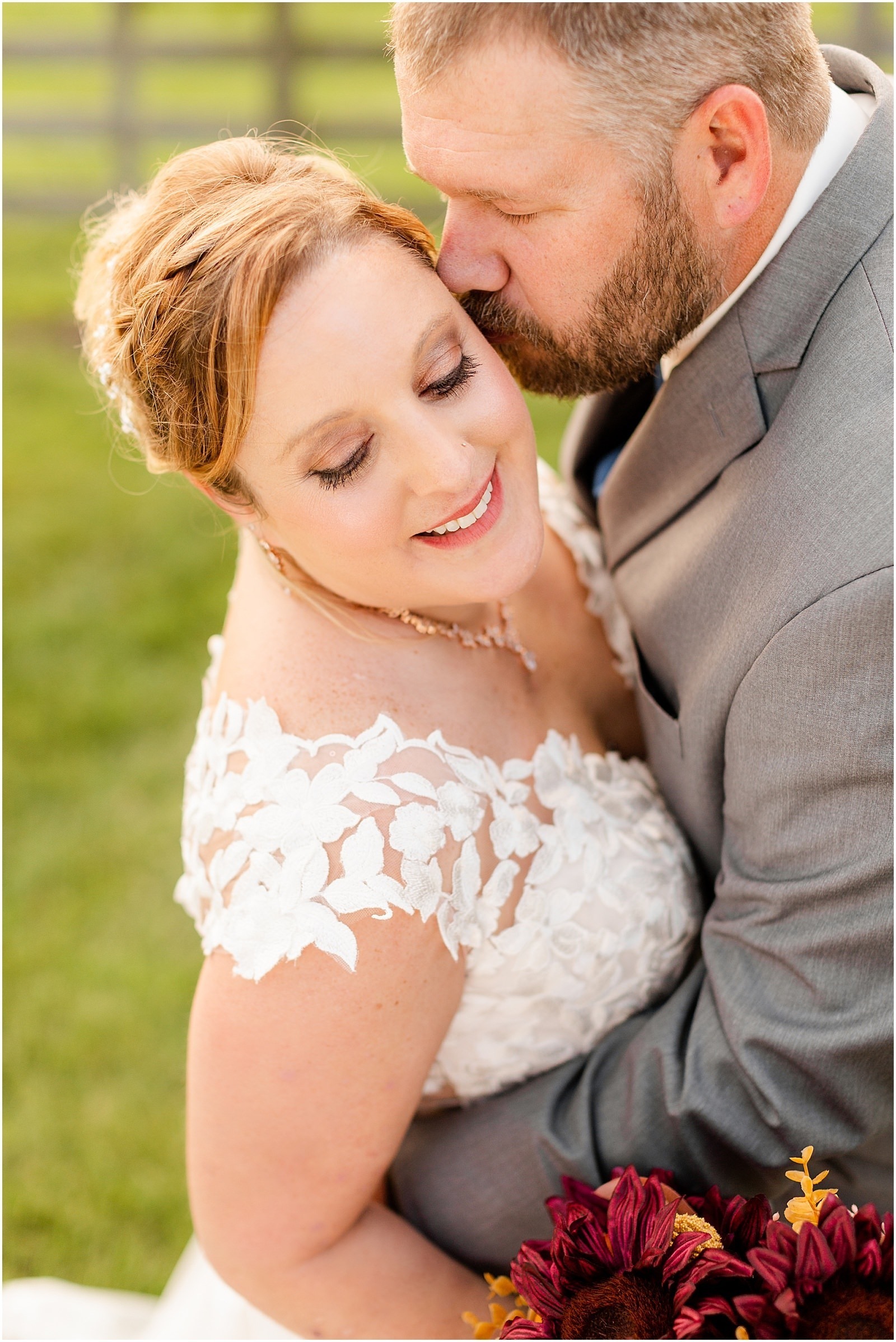 groom kissing bride on the cheek